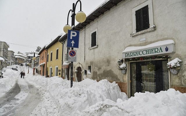 People walk in the snow in Monterale's main street, near Amatrice, after a 5.7-magnitude earthquake struck the region, on January 18, 2017. (AFP/ANDREAS SOLARO) People walk in the snow in Monterale's main street, near Amatrice, after a 5.7-magnitude earthquake struck the region, on January 18, 2017. (AFP/ANDREAS SOLARO)