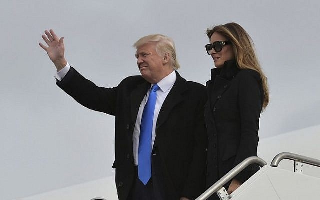 US President-elect Donald Trump and his wife Melania step off a plane upon arrival at Andrews Air Force Base in Maryland on January 19, 2017. (AFP PHOTO / MANDEL NGAN) US President-elect Donald Trump and his wife Melania step off a plane upon arrival at Andrews Air Force Base in Maryland on January 19, 2017. (AFP PHOTO / MANDEL NGAN)