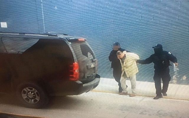 Joaquin 'El Chapo' Guzman (center) being escorted in an unknown location by Mexican police as he is extradited to the United States on January 19, 2017. (AFP/Mexican Interior Ministry) Joaquin 'El Chapo' Guzman (center) being escorted in an unknown location by Mexican police as he is extradited to the United States on January 19, 2017. (AFP/Mexican Interior Ministry)