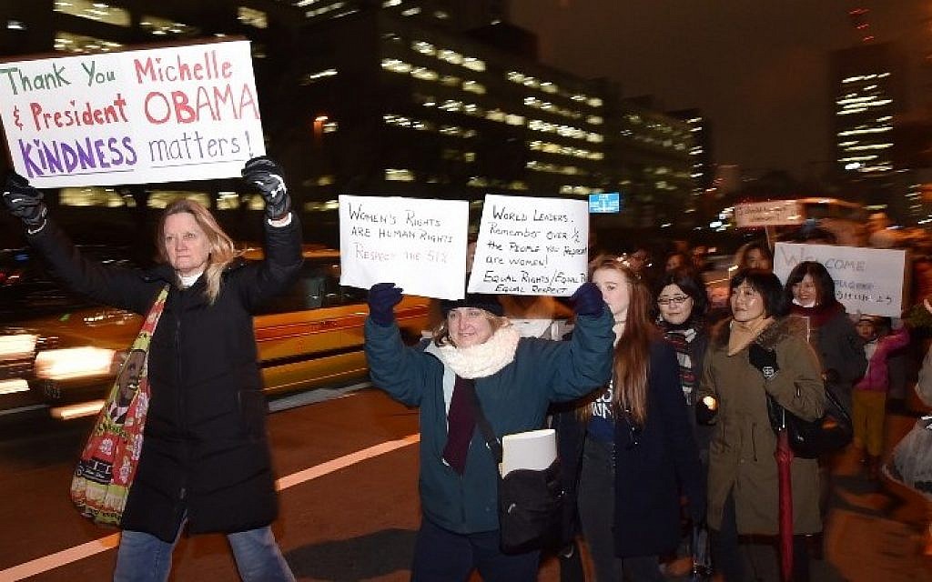 People stage a demonstration march in connection with the US presidential inauguration in Tokyo on January 20, 2017. 
Americans living in Japan held a march to thank outgoing President Barack Obama for his service. (AFP PHOTO / KAZUHIRO NOGI)