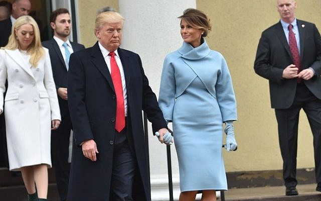 US President-elect Donald Trump and his wife Melania leave St. John's Episcopal Church on January 20, 2017, before Trump's inauguration.  (AFP PHOTO / Nicholas Kamm)