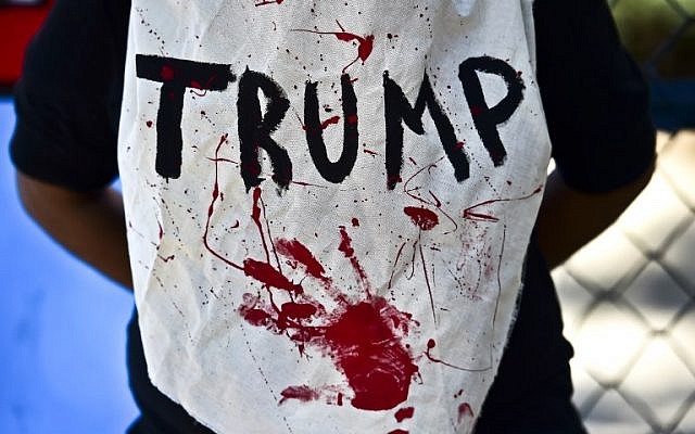 A woman protests against the new US President Donald Trump, in Mexico City during his inauguration day on January 20, 2017. (AFP PHOTO / RONALDO SCHEMIDT) A woman protests against the new US President Donald Trump, in Mexico City during his inauguration day on January 20, 2017. (AFP PHOTO / RONALDO SCHEMIDT)