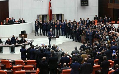 Turkey's Prime Minister Binali Yildirim, center, is applauded by some of his lawmakers after Turkey's parliament approved a contentious constitutional reform package, paving the way for a referendum on a presidential system that would greatly expand the powers of President Recep Tayyip Erdogan's office, on January 21, 2017 in Ankara. (Adem Altan/AFP) Turkey's Prime Minister Binali Yildirim, center, is applauded by some of his lawmakers after Turkey's parliament approved a contentious constitutional reform package, paving the way for a referendum on a presidential system that would greatly expand the powers of President Recep Tayyip Erdogan's office, on January 21, 2017 in Ankara. (Adem Altan/AFP)