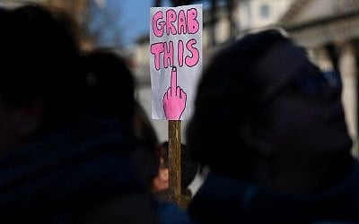 Protesters hold a home-made placard during the Women's March in Trafalgar Square in London on January 21, 2017 as part of a global day of protests against new US President Donald Trump. (AFP PHOTO/BEN STANSALL)