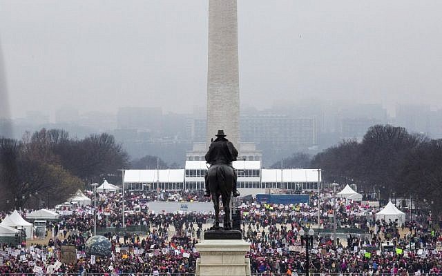 Protesters crowd the National Mall in Washington, DC, during the Women's March on January 21, 2017. (AFP PHOTO/ZACH GIBSON) Protesters crowd the National Mall in Washington, DC, during the Women's March on January 21, 2017. (AFP PHOTO/ZACH GIBSON)