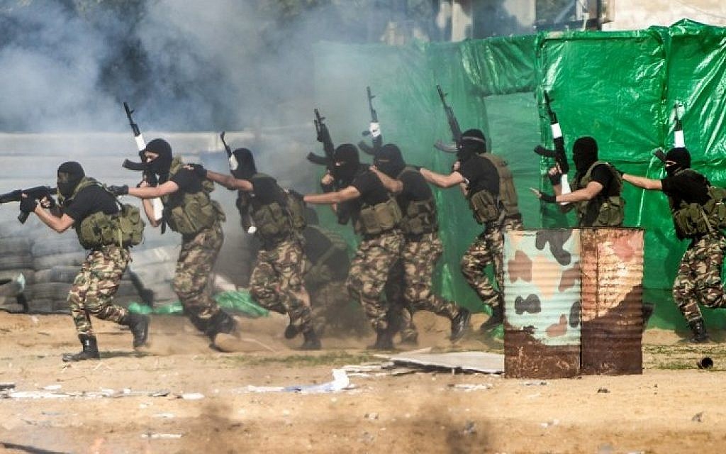 Members of the Palestinian terror group Hamas's security forces stage a mock raid on IDF post during a graduation ceremony in Gaza City on January 22, 2017. (Mahmud Hams/AFP) Members of the Palestinian terror group Hamas's security forces stage a mock raid on IDF post during a graduation ceremony in Gaza City on January 22, 2017. (Mahmud Hams/AFP)