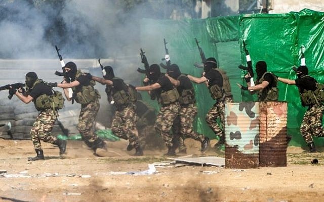Members of the Palestinian terror group Hamas's security forces stage a mock raid on IDF post during a graduation ceremony in Gaza City on January 22, 2017. (Mahmud Hams/AFP)