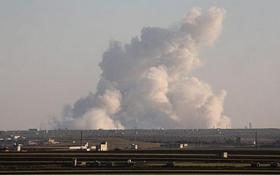 A picture taken from a rebel-held area shows smoke billowing in the Al-Nayrab area, near Idlib, following reported Syrian government air strikes on January 22, 2017. (AFP Photo/Omar Haj Kadour)