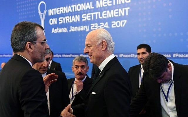 UN envoy for Syria Staffan de Mistura (C) meets with an Iranian delegation prior to the first session of Syria peace talks at Astana's Rixos President Hotel on January 23, 2017. (AFP Photo/Kirill Kudryavtsev)