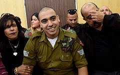 IDF soldier Elor Azaria, who was convicted of manslaughter for shooting dead a prone and wounded Palestinian assailant, in a case that has deeply divided Israel, sits with his parents as he waits for his sentence hearing at a military court in Tel Aviv January 24, 2017. (AFP/Debbie Hill)