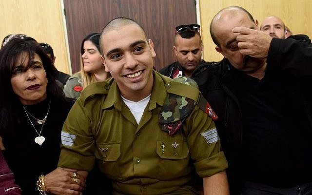 IDF soldier Elor Azaria, who was convicted of manslaughter for shooting dead a prone and wounded Palestinian assailant, in a case that has deeply divided Israel, sits with his parents as he waits for his sentence hearing at a military court in Tel Aviv January 24, 2017. (AFP/Debbie Hill) IDF soldier Elor Azaria, who was convicted of manslaughter for shooting dead a prone and wounded Palestinian assailant, in a case that has deeply divided Israel, sits with his parents as he waits for his sentence hearing at a military court in Tel Aviv January 24, 2017. (AFP/Debbie Hill)