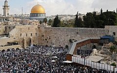 This file photo taken on October 19, 2016 shows Jewish worshippers performing the annual Cohanim prayer (priest's blessing) at the Western Wall in the Old City of Jerusalem on October 19, 2016. (AFP/Gil COhen-Magen)