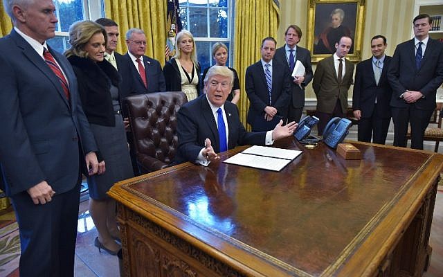 US President Donald Trump speaks before a signing ceremony for executive orders and memorandums in the Oval Office of the White House on January 28, 2017, in Washington, DC. (AFP PHOTO / MANDEL NGAN) US President Donald Trump speaks before a signing ceremony for executive orders and memorandums in the Oval Office of the White House on January 28, 2017, in Washington, DC. (AFP PHOTO / MANDEL NGAN)