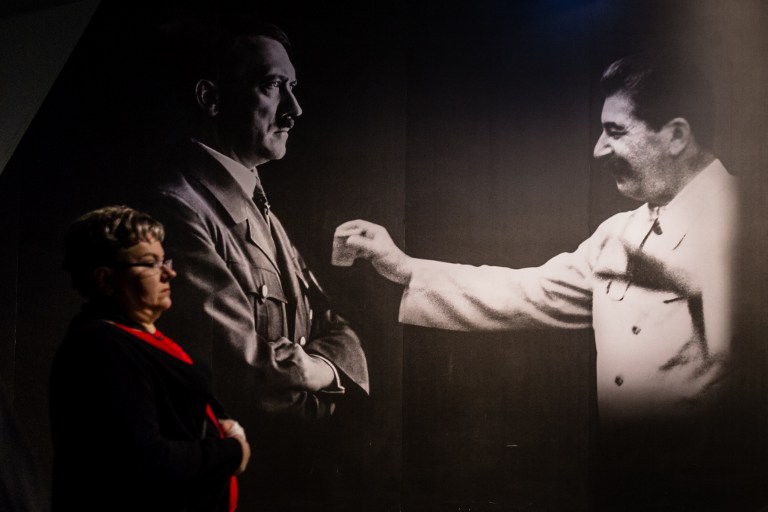 A woman passes by photographs of Adolf Hitler and Joseph Stalin on January 29, 2017 at the permanent exhibition of Museum of Second World War open days ahead of the official opening planned for the end of February in Gdansk, Poland. (AFP PHOTO / Wojtek RADWANSKI) A woman passes by photographs of Adolf Hitler and Joseph Stalin on January 29, 2017 at the permanent exhibition of Museum of Second World War open days ahead of the official opening planned for the end of February in Gdansk, Poland. (AFP PHOTO / Wojtek RADWANSKI)