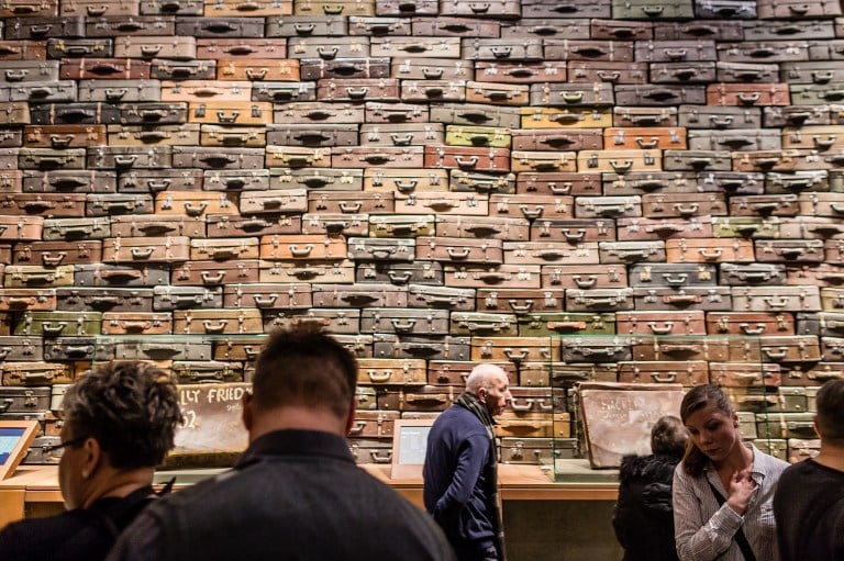 People look at piled up suitcases on January 29, 2017 as part of the permanent exhibition of Museum of Second World War opened for two days ahead the official opening planned for the end of February in Gdansk, Poland. (AFP PHOTO / Wojtek RADWANSKI) People look at piled up suitcases on January 29, 2017 as part of the permanent exhibition of Museum of Second World War opened for two days ahead the official opening planned for the end of February in Gdansk, Poland. (AFP PHOTO / Wojtek RADWANSKI)