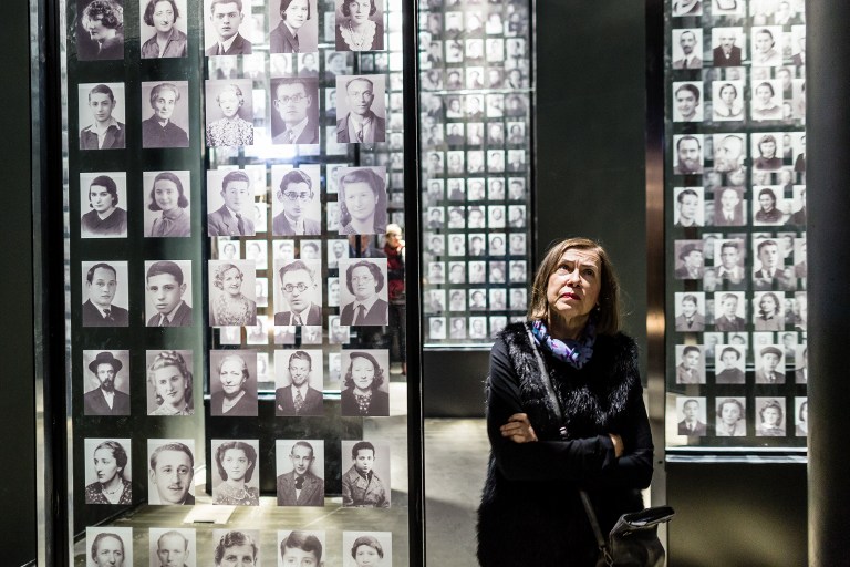 A woman looks at photographs on January 29, 2017 as part of the permanent exhibition of Museum of Second World War opened for two days ahead of the official opening planned for the end of February in Gdansk, Poland. (AFP PHOTO / Wojtek RADWANSKI) A woman looks at photographs on January 29, 2017 as part of the permanent exhibition of Museum of Second World War opened for two days ahead of the official opening planned for the end of February in Gdansk, Poland. (AFP PHOTO / Wojtek RADWANSKI)