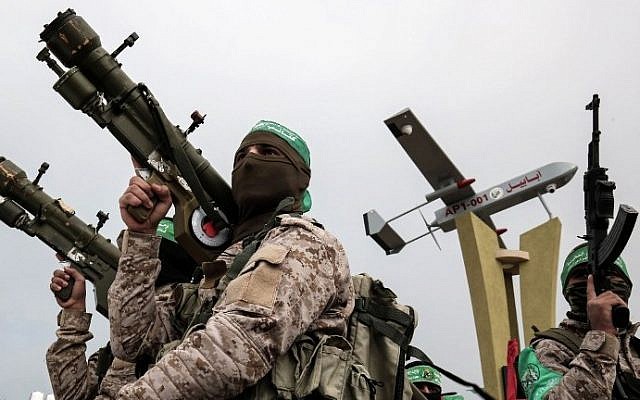 Members of the Hamas armed wing attend a memorial in the southern Gaza Strip town of Rafah on January 31, 2017. (AF /SAID KHATIB) Members of the Hamas armed wing attend a memorial in the southern Gaza Strip town of Rafah on January 31, 2017. (AF /SAID KHATIB)