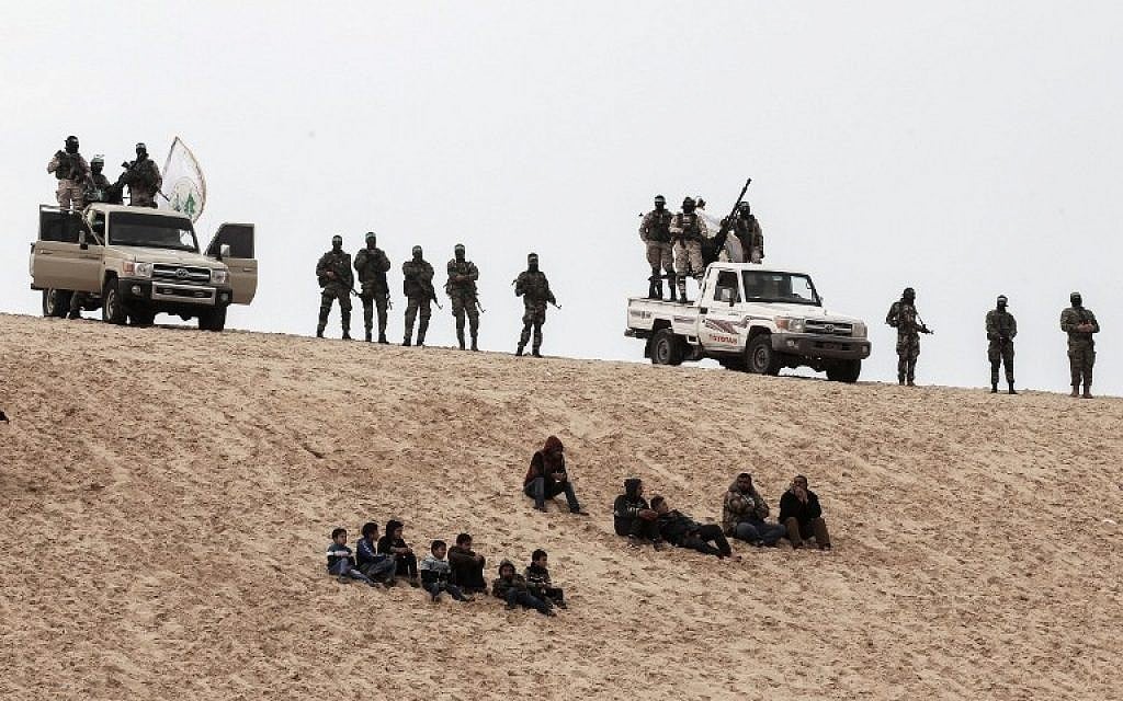 Members of the Hamas terror group's military wing attend a memorial in the southern Gaza Strip town of Rafah on January 31, 2017, for Mohamed Zouari, a 49-year-old Tunisian engineer and drone expert, who was killed at the wheel of his car outside his house in Tunisia in December 2016.  (AFP Photo/Said Khatib)