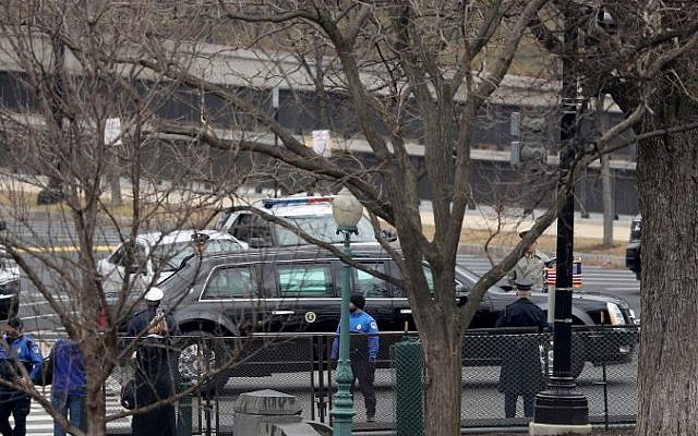 The limousine carrying President Barack Obama and President-elect Donald Trump drives towards the U.S. Capitol on January 20, 2017 in Washington, DC. (Joe Raedle/Getty Images/AFP)
