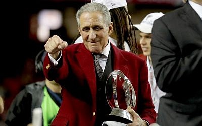 Atlanta Falcons owner Arthur Blank holds the George Halas trophy after defeating the Green Bay Packers in the NFC Championship Game on January 22, 2017 in Atlanta, Georgia. (Streeter Lecka/Getty Images/AFP)