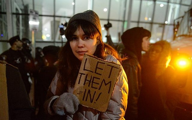 Protestors rally during a demonstration against the new immigration ban issued by US President Donald Trump at John F. Kennedy International Airport, in New York City, January 28, 2017. (Stephanie Keith/Getty Images/AFP)
