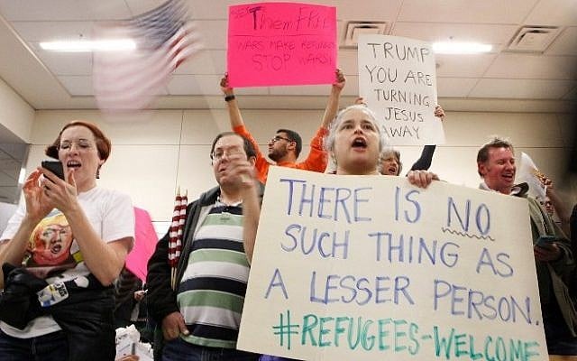 Protesters gather to denounce President Donald Trump's executive order that bans certain immigration, at Dallas-Fort Worth International Airport, in Dallas, Texas, January 28, 2017. (G. Morty Ortega/Getty Images/AFP)