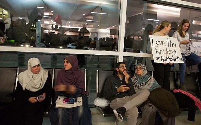 Protesters gather to denounce US President Donald Trump's executive order that bans certain immigration, at Dallas-Fort Worth International Airport, in Dallas, Texas January 28, 2017. (G. Morty Ortega/Getty Images/AFP)
