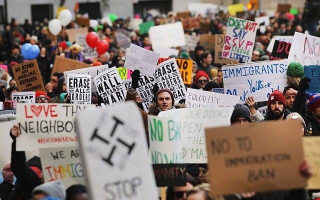People march in lower Manhattan to protest US President Donald Trump's new immigration policies on January 29, 2017 in New York City. (Spencer Platt/Getty Images/AFP) People march in lower Manhattan to protest US President Donald Trump's new immigration policies on January 29, 2017 in New York City. (Spencer Platt/Getty Images/AFP)