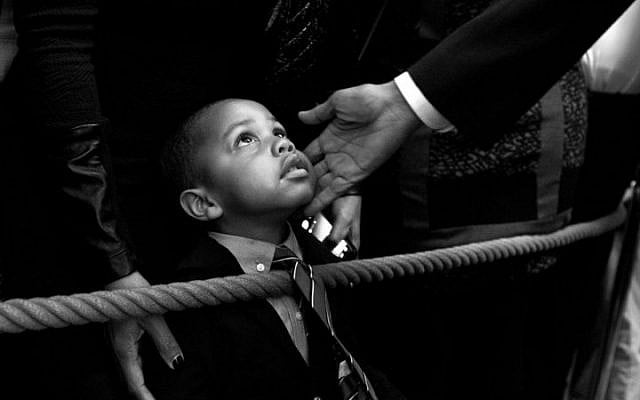 'I had my eye on this youngster while President Barack Obama spoke during a reception at the White House celebrating African American History Month. When the president starting greeting audience members along the rope line, I bent down in front of the young man and captured this moment of the president touching his face before he too bent down to greet him. Afterwards, I tracked down his name — Clark Reynolds — and had the president sign a copy for him,' Feb. 18, 2016. (Official White House photo/Pete Souza)