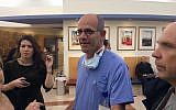 Dr. Ofer Merin speaking with reporters at Shaare Zedek medical center following a terror attack in Jerusalem, January 8, 2017. (Renee Ghert-Zand/Times of Israel)
