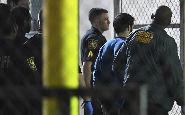 Esteban Santiago, 26, the suspect in the deadly shooting at Fort Lauderdale-Hollywood International Airport, is transported to the Broward County Main Jail by authorities, Saturday, January 7, 2017. (Jim Rassol/South Florida Sun-Sentinel via AP) Esteban Santiago, 26, the suspect in the deadly shooting at Fort Lauderdale-Hollywood International Airport, is transported to the Broward County Main Jail by authorities, Saturday, January 7, 2017. (Jim Rassol/South Florida Sun-Sentinel via AP)
