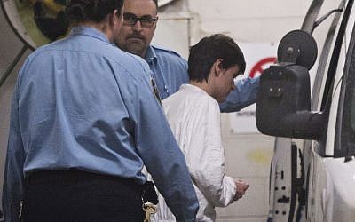 Alexandre Bissonnette is escorted to a van January 30, 2017, in Quebec City, after appearing in court for Sunday's deadly shooting at a mosque. (Jacques Boissinot/The Canadian Press via AP)