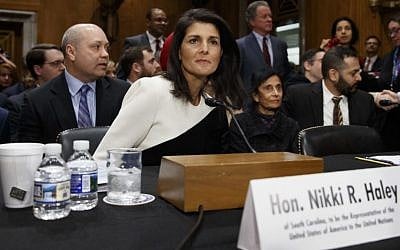UN Ambassador-designate, South Carolina Gov. Nikki Haley, accompanied by her husband Michael, left, prepares to testify on Capitol Hill in Washington, Wednesday, Jan. 18, 2017, at her confirmation hearing before the Senate Foreign Relations Committee. (AP Photo/Evan Vucci)