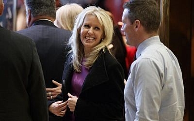 Monica Crowley smiles as she exits the elevator in the lobby of Trump Tower in New York, Thursday, Dec. 15, 2016 (AP Photo/Evan Vucci)