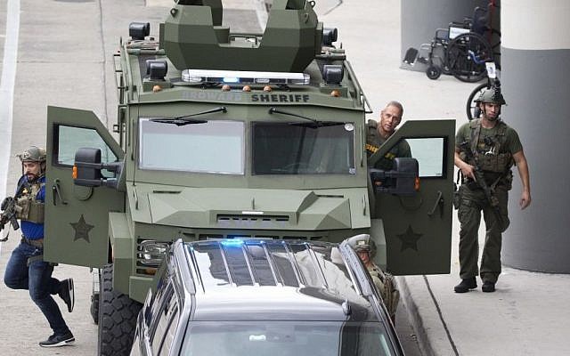 Law enforcement personnel arrive in an armored car outside Fort Lauderdale–Hollywood International Airport, Friday, Jan. 6, 2017 (AP Photo/Wilfredo Lee)