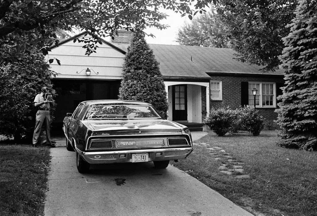 A police officer photographs the car from which Col. Yosef Alon, air attache to the Israeli Embassy in Washington, was stepping when he was shot to death July 1, 1973 outside his Bethesda, MD., home. (AP Photo/John Duricka) A police officer photographs the car from which Col. Yosef Alon, air attache to the Israeli Embassy in Washington, was stepping when he was shot to death July 1, 1973 outside his Bethesda, MD., home. (AP Photo/John Duricka)