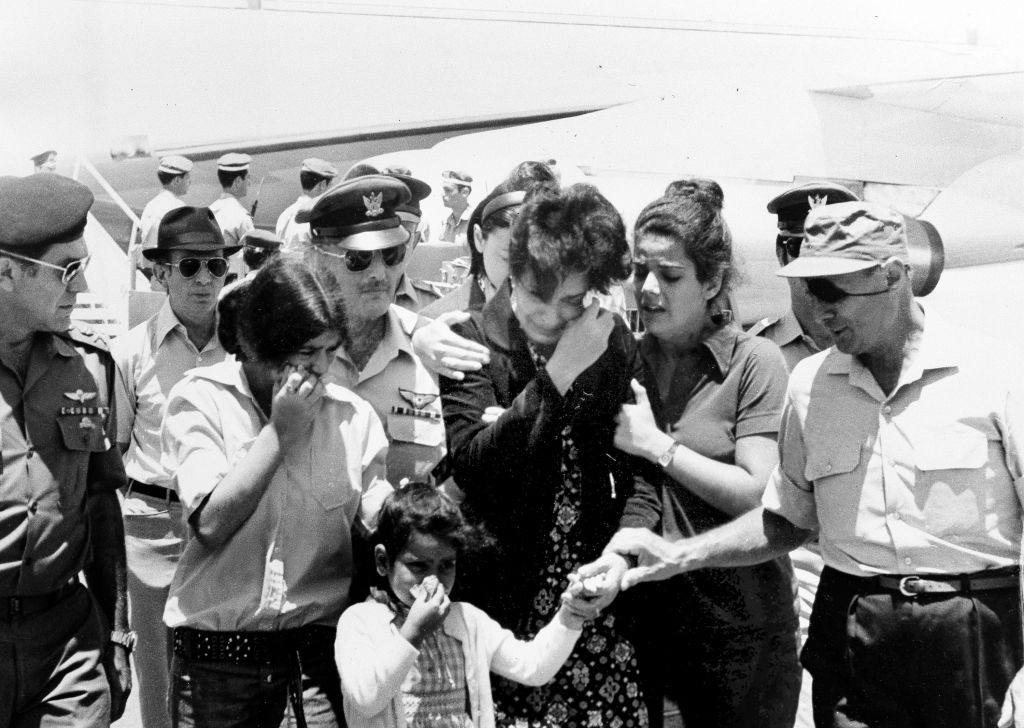 Israeli Defense Minister Moshe Dayan, (r), comforts the family of Israeli Col. Yosef Alon after the family arrived at Lod Airport in Israel with Alon's body, July 2, 1973. (AP Photo/stf) Israeli Defense Minister Moshe Dayan, (r), comforts the family of Israeli Col. Yosef Alon after the family arrived at Lod Airport in Israel with Alon's body, July 2, 1973. (AP Photo/stf)