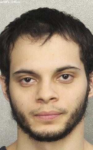 This booking photo provided by the Broward Sheriff's Office shows suspect Esteban Ruiz Santiago, 26, Saturday, January 7, 2017, in Fort Lauderdale, Fla. (Broward Sheriff's Office via AP)