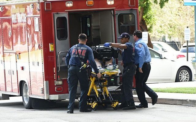 A shooting victim is unloaded from an emergency vehicle and taken into Broward Health Trauma Center in Fort Lauderdale, Fla., Friday, Jan. 6, 2017 (Taimy Alvarez/South Florida Sun-Sentinel via AP)