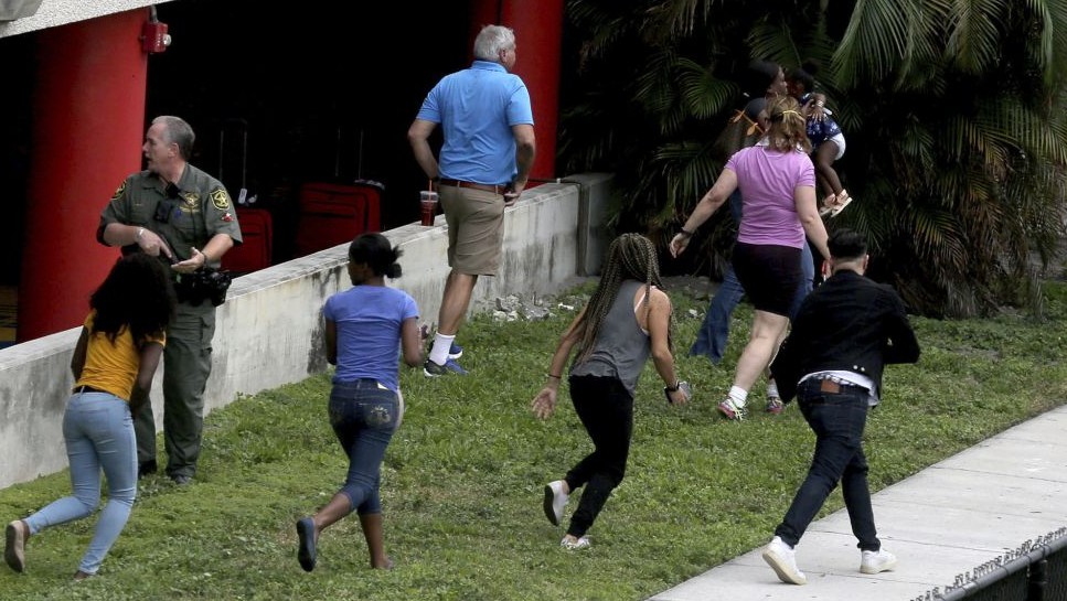 People flee the area outside the Fort Lauderdale-Hollywood International airport after a shooting took place Friday, Jan. 6, 2017 in Fort Lauderdale, Fla. (Mike Stocker/South Florida Sun-Sentinel via AP) People flee the area outside the Fort Lauderdale-Hollywood International airport after a shooting took place Friday, Jan. 6, 2017 in Fort Lauderdale, Fla. (Mike Stocker/South Florida Sun-Sentinel via AP)