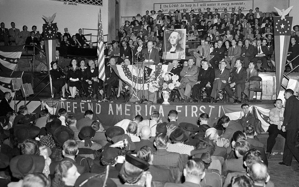 A crowd of over 4,000 people filled the Gospel Tabernacle in Fort Wayne, Indiana, to hear Col. Charles Lindbergh, seen on the speaker's stand in the center, address a rally of the America First Committee in 1940. (AP Photo/File) A crowd of over 4,000 people filled the Gospel Tabernacle in Fort Wayne, Indiana, to hear Col. Charles Lindbergh, seen on the speaker's stand in the center, address a rally of the America First Committee in 1940. (AP Photo/File)
