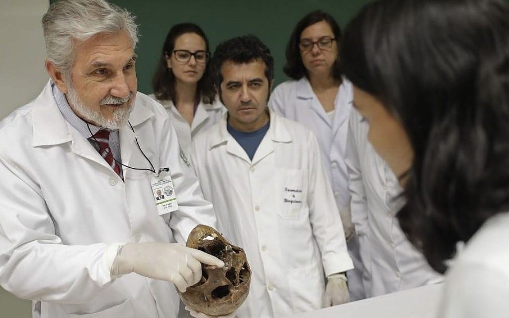 Illustrative: Forensic doctor Daniel Muniz displays the skull of Nazi war criminal Josef Mengele at the School of Medicine, University of Sao Paulo, Brazil, December 7, 2016. (AP/Andre Penner) Illustrative: Forensic doctor Daniel Muniz displays the skull of Nazi war criminal Josef Mengele at the School of Medicine, University of Sao Paulo, Brazil, December 7, 2016. (AP/Andre Penner)