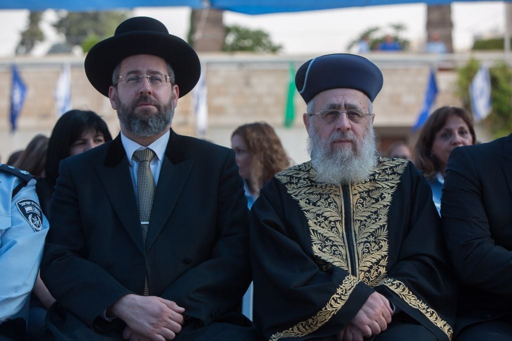 Ashkenazi Chief Rabbi David Lau, left, and Sephardi Chief Rabbi Yitzhak Yosef attending a New Year’s ceremony at the national headquarters of the Israel Police in Jerusalem, September 7, 2015. (Yonatan Sindel/Flash90) Ashkenazi Chief Rabbi David Lau, left, and Sephardi Chief Rabbi Yitzhak Yosef attending a New Year’s ceremony at the national headquarters of the Israel Police in Jerusalem, September 7, 2015. (Yonatan Sindel/Flash90)