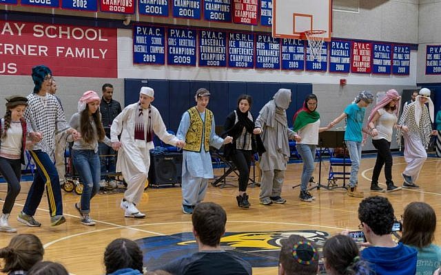 Teacher Hani Abo Awad stands at rear as his Arabic class performs at dance at the Charles E. Smith Jewish Day School in Rockville, Maryland, 2016. (Courtesy)