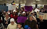People protesting and welcoming arriving passengers at Dulles International Airport in Virginia, Jan. 28, 2017. (Astrid Riecken for The Washington Post via Getty Images/JTA)