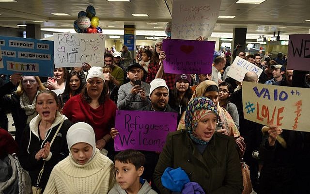 People protesting and welcoming arriving passengers at Dulles International Airport in Virginia, Jan. 28, 2017. (Astrid Riecken for The Washington Post via Getty Images/JTA) People protesting and welcoming arriving passengers at Dulles International Airport in Virginia, Jan. 28, 2017. (Astrid Riecken for The Washington Post via Getty Images/JTA)