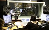 Illustrative: Radio broadcasters at Army Radio headquarters in Jaffa, on March 27, 2014. (Tomer Neuberg/Flash 90)