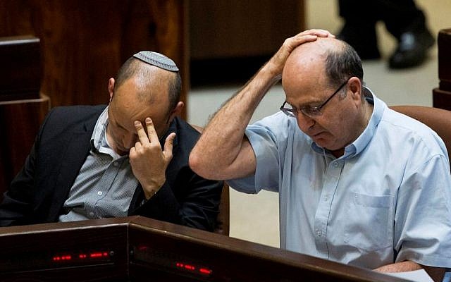 Then defense minister Moshe Ya'alon (R) seen with Education Minister Naftali Bennett during a plenum session at the plenary in the Knesset on May 25, 2015. (Yonatan Sindel/Flash90) Then defense minister Moshe Ya'alon (R) seen with Education Minister Naftali Bennett during a plenum session at the plenary in the Knesset on May 25, 2015. (Yonatan Sindel/Flash90)