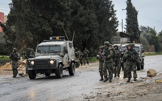 Illustrative: Security forces during clashes with protesters at the entrance to the village of Qabatiya in Jenin, February 6, 2016. (Haytham Shtayeh/FLASH90) Illustrative: Security forces during clashes with protesters at the entrance to the village of Qabatiya in Jenin, February 6, 2016. (Haytham Shtayeh/FLASH90)