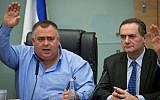 Coalition Chairman David Bitan seen with Transportation Minister Yisrael Katz (R) during a Knesset committee meeting in the Knesset, on March 23, 2016 (Yonatan Sindel/Flash90)